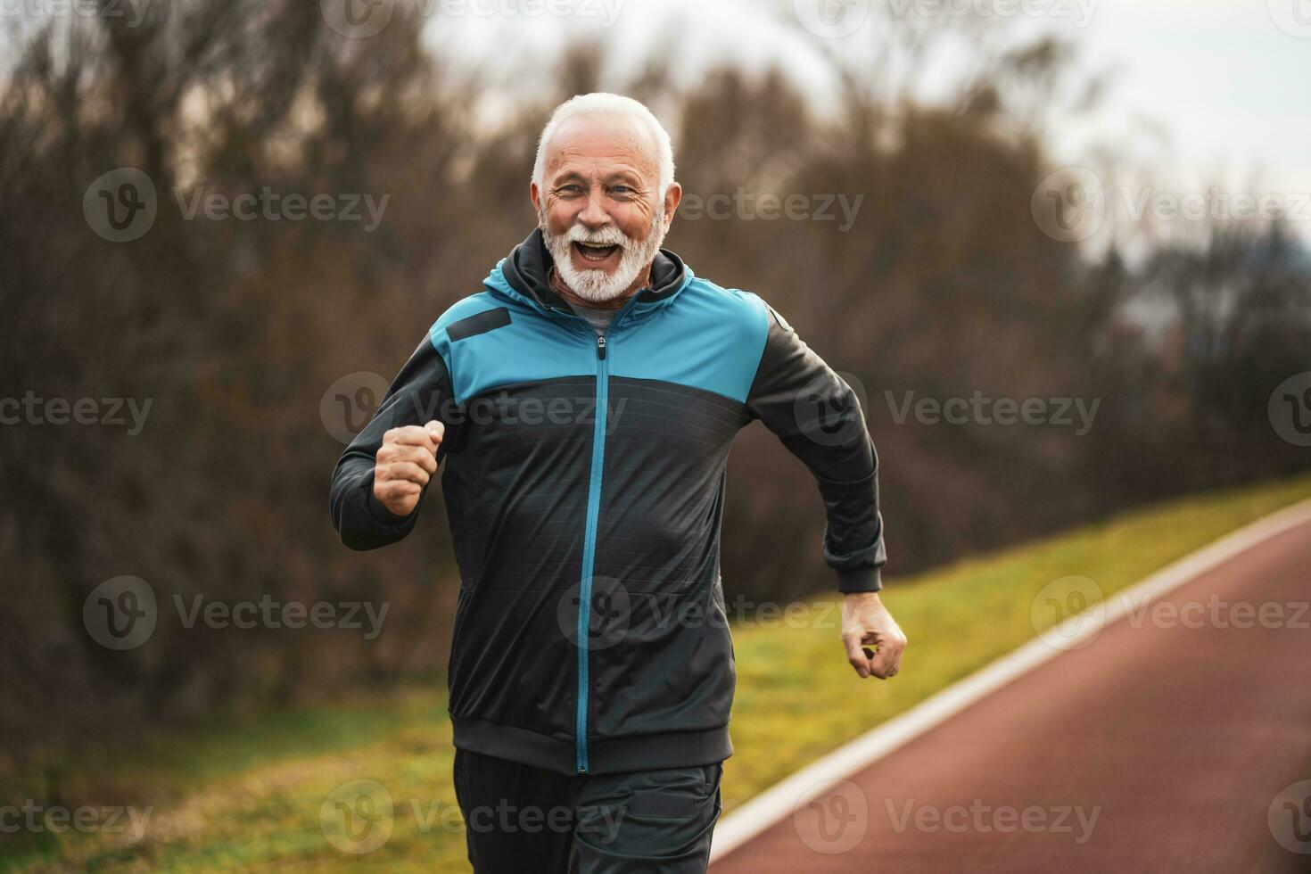 A senior man doing physical exercises photo