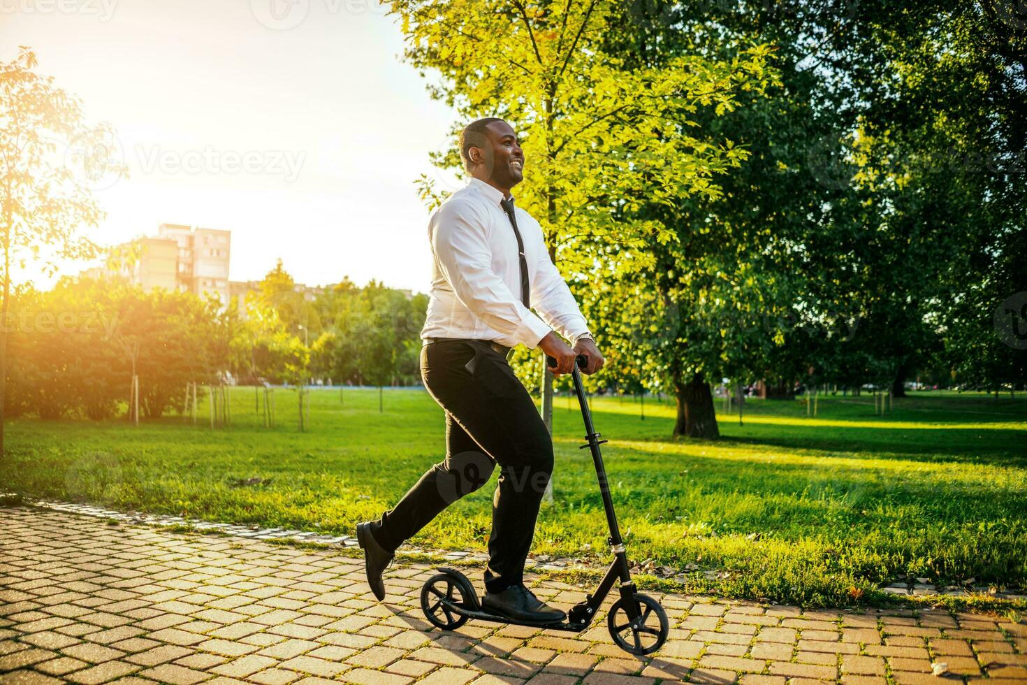 Afro businessman on a scooter photo