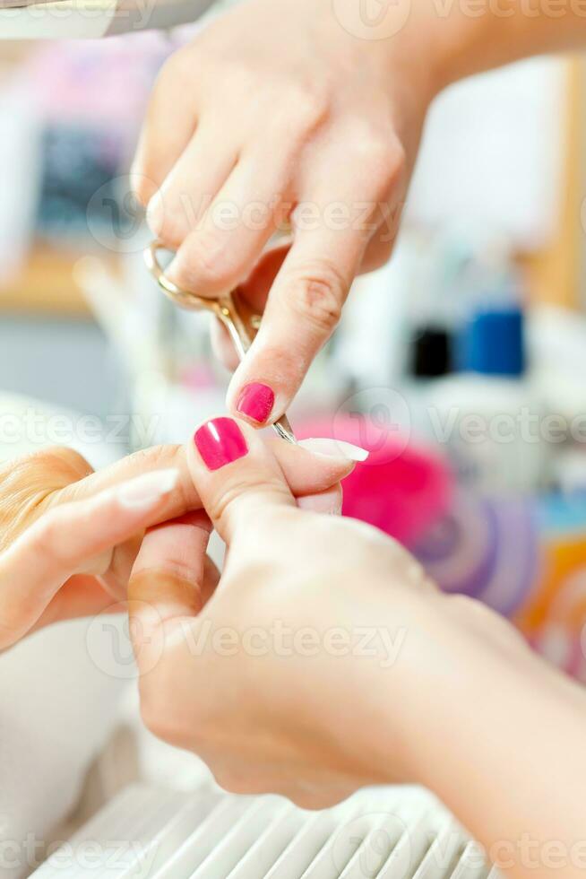 Nail treatment in a beauty salon photo