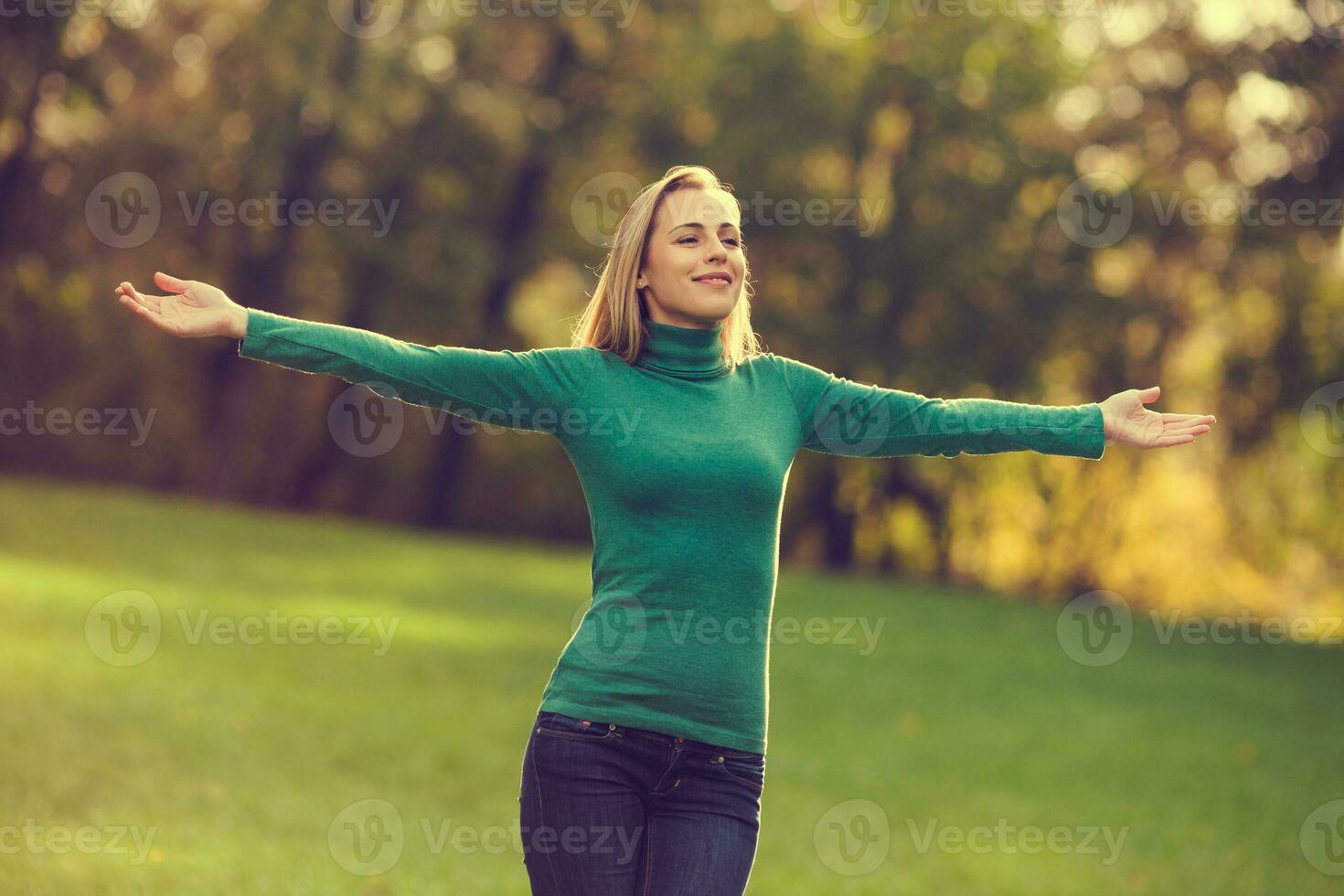 A happy woman in the park photo