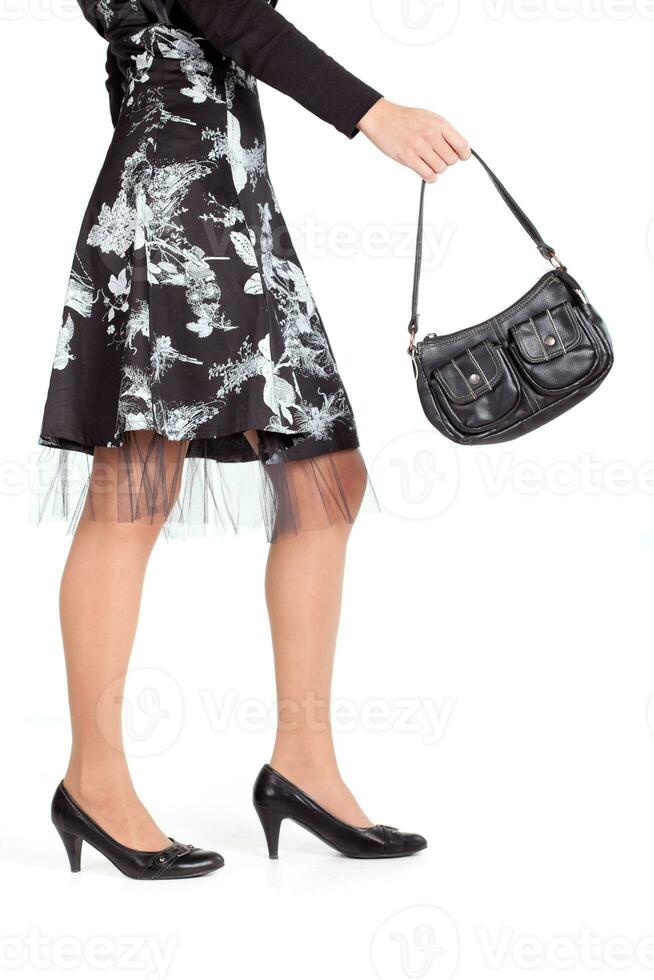 Woman legs on high heels close-up photo