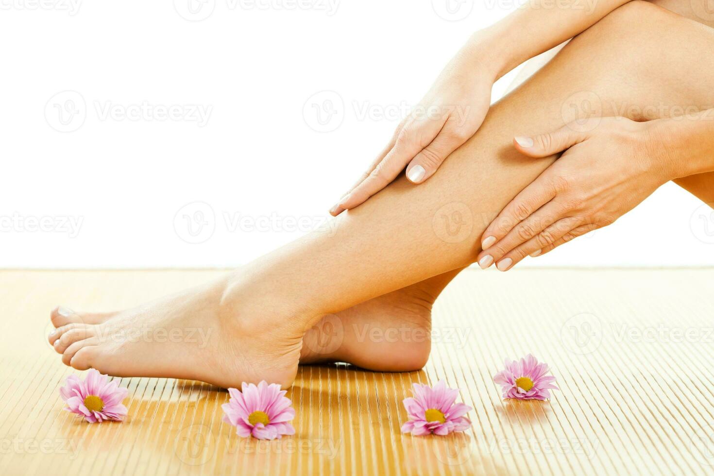 A woman taking care of her feet photo