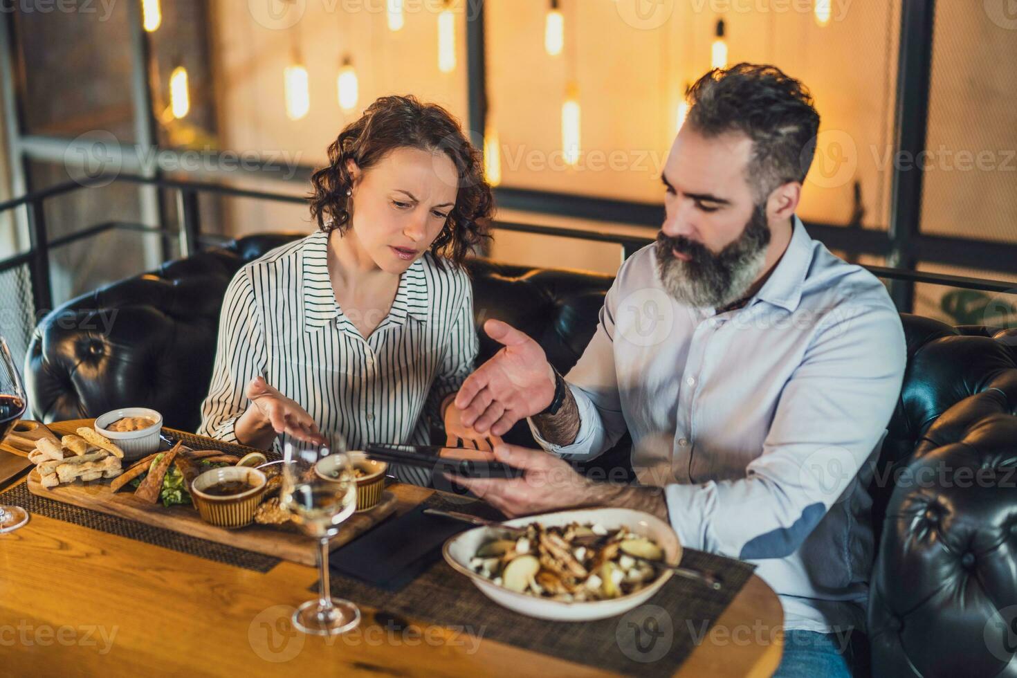 A couple having dinner photo