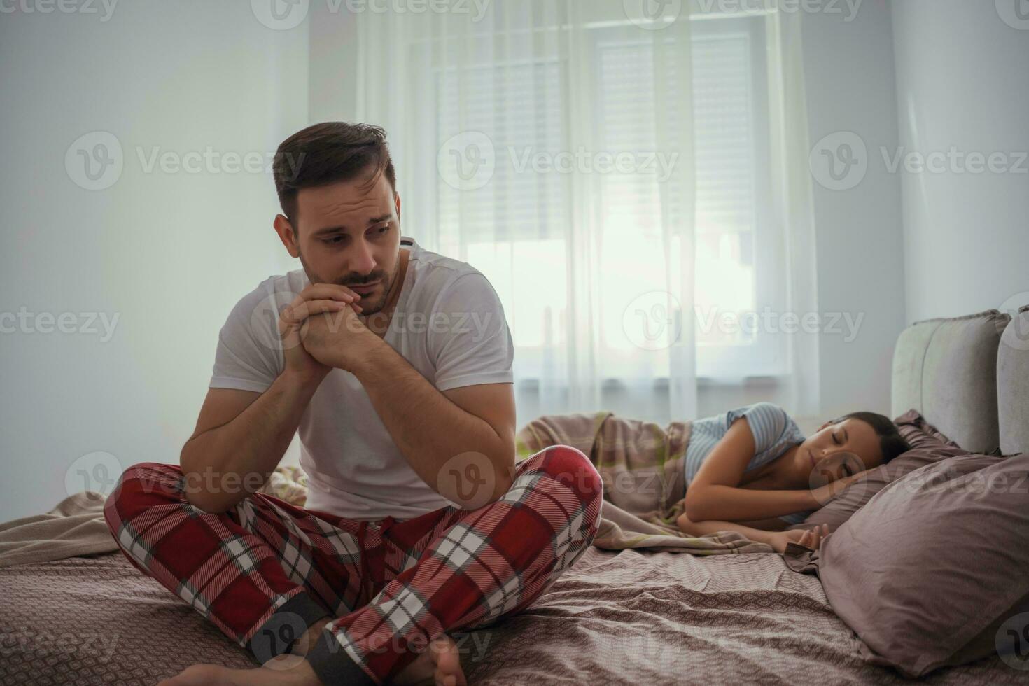 An upset man waking up in the morning photo