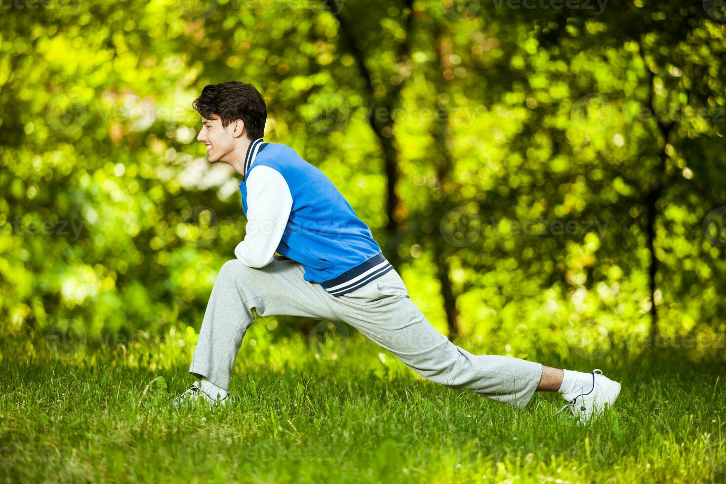 A man doing physical exercises outdoors photo