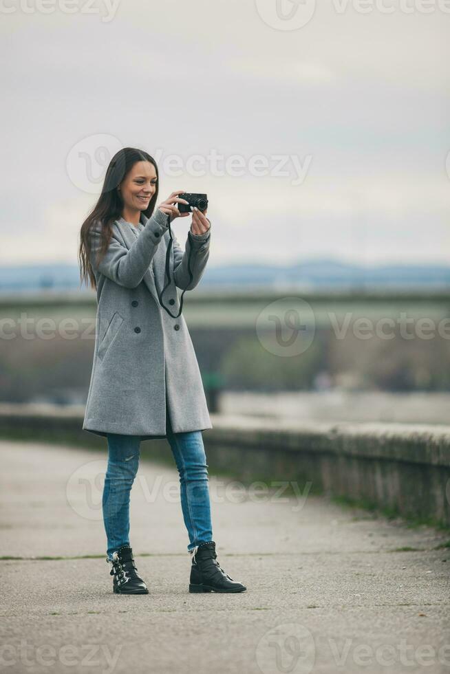 Young woman is taking a photo after work.