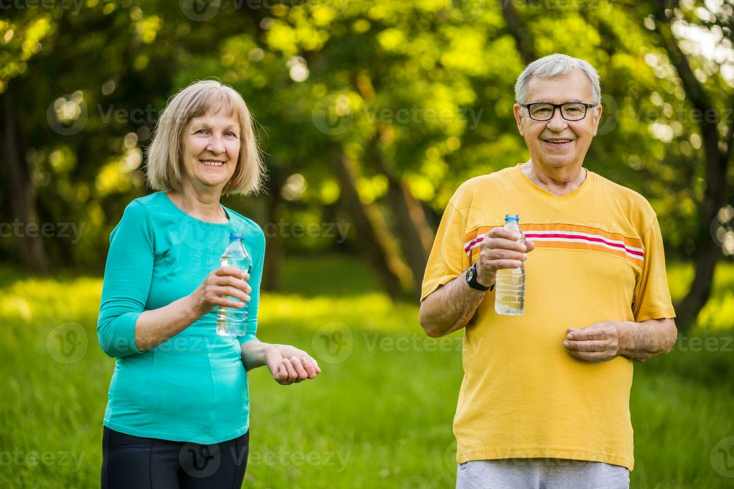 A senior couple doing physical exercises photo