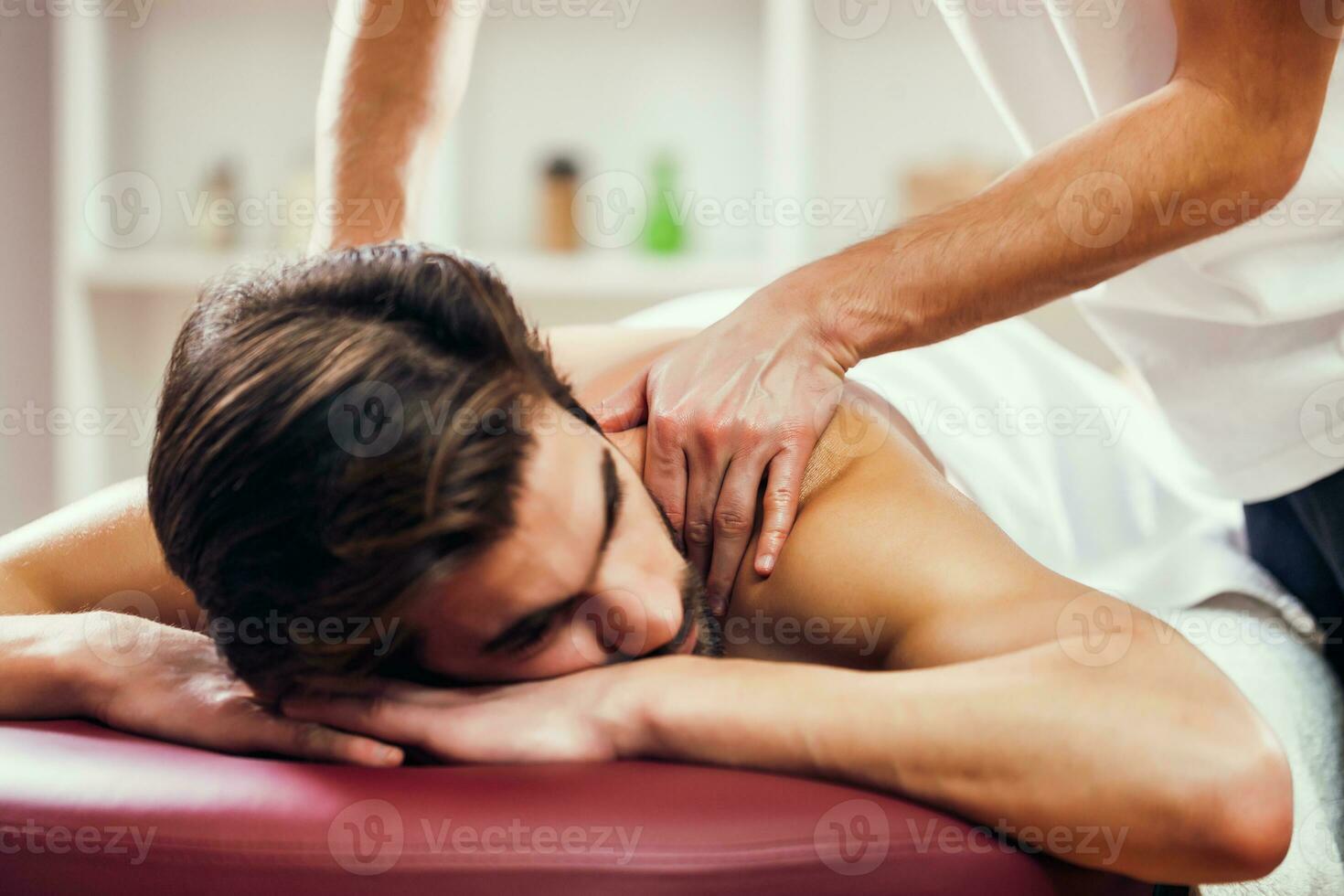 A man getting a back massage photo