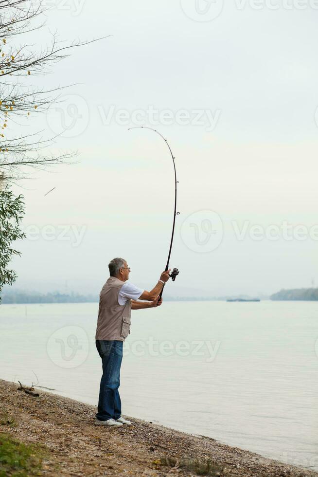 A senior man fishing photo