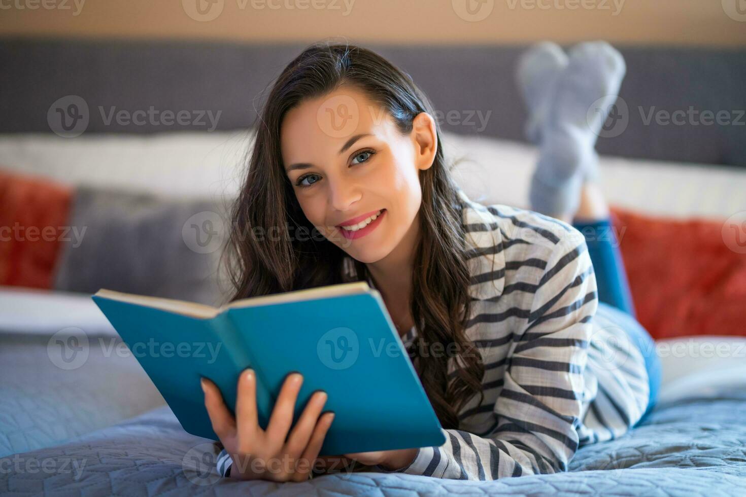 A woman resting in her bed photo