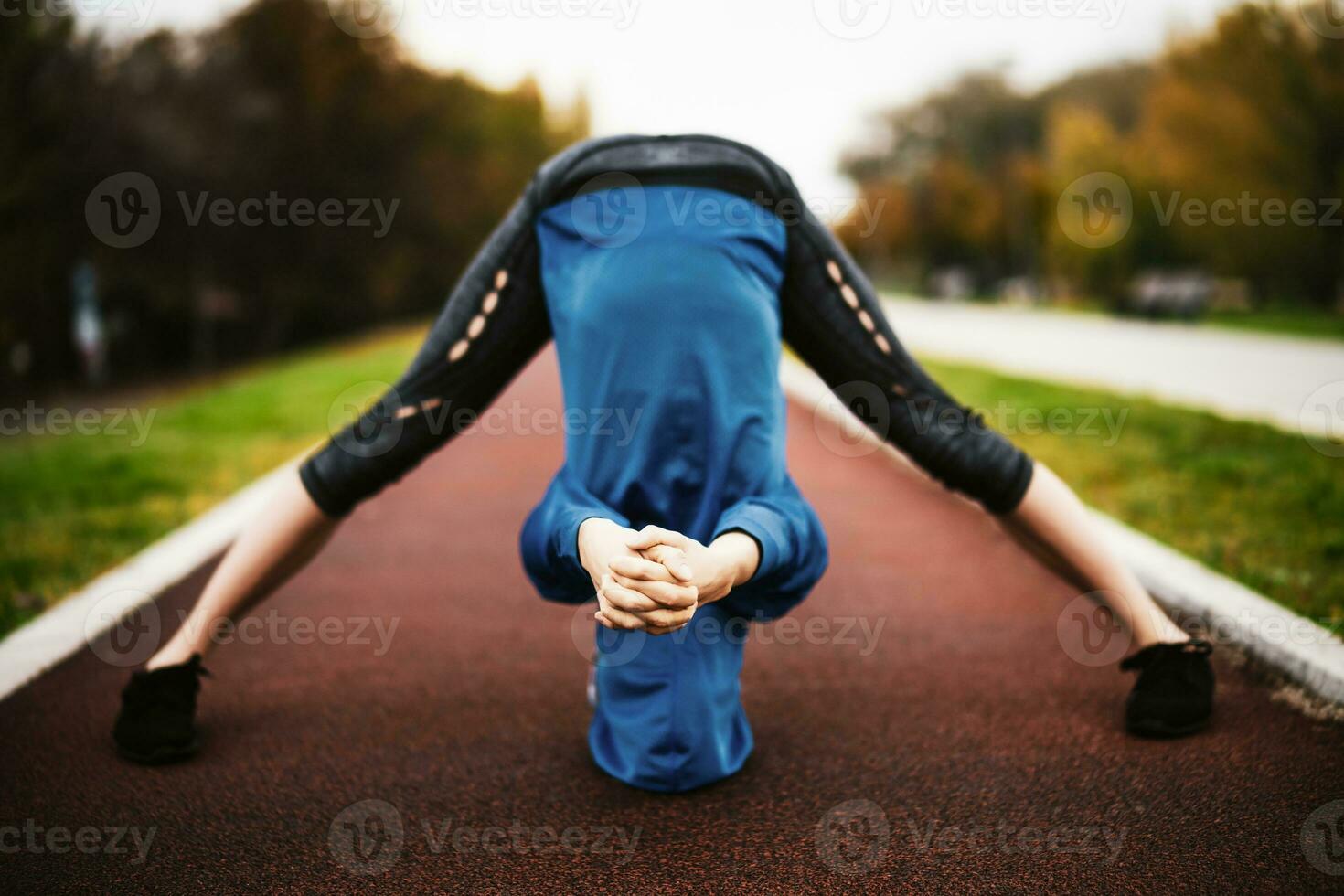 A young woman doing physical exercises photo