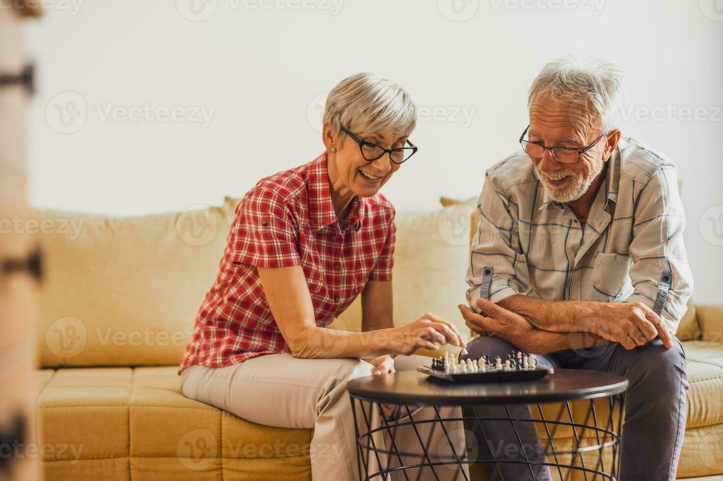 A senior couple playing chess. photo