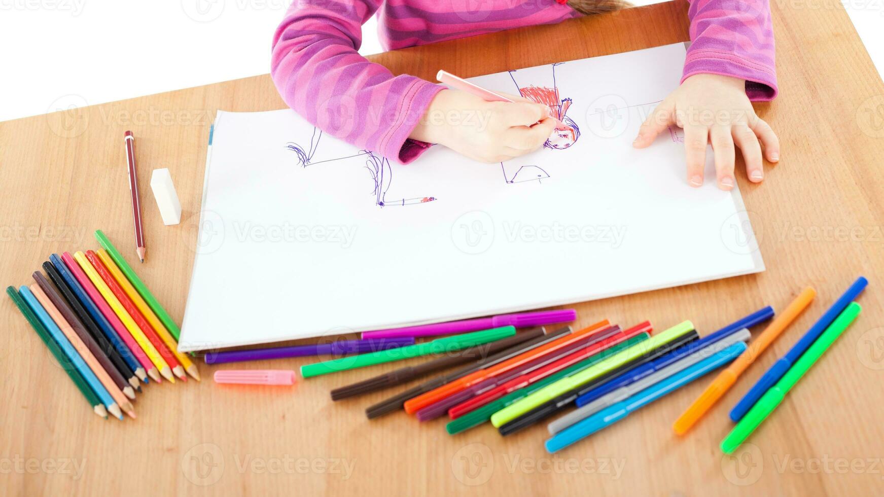 A little girl drawing photo