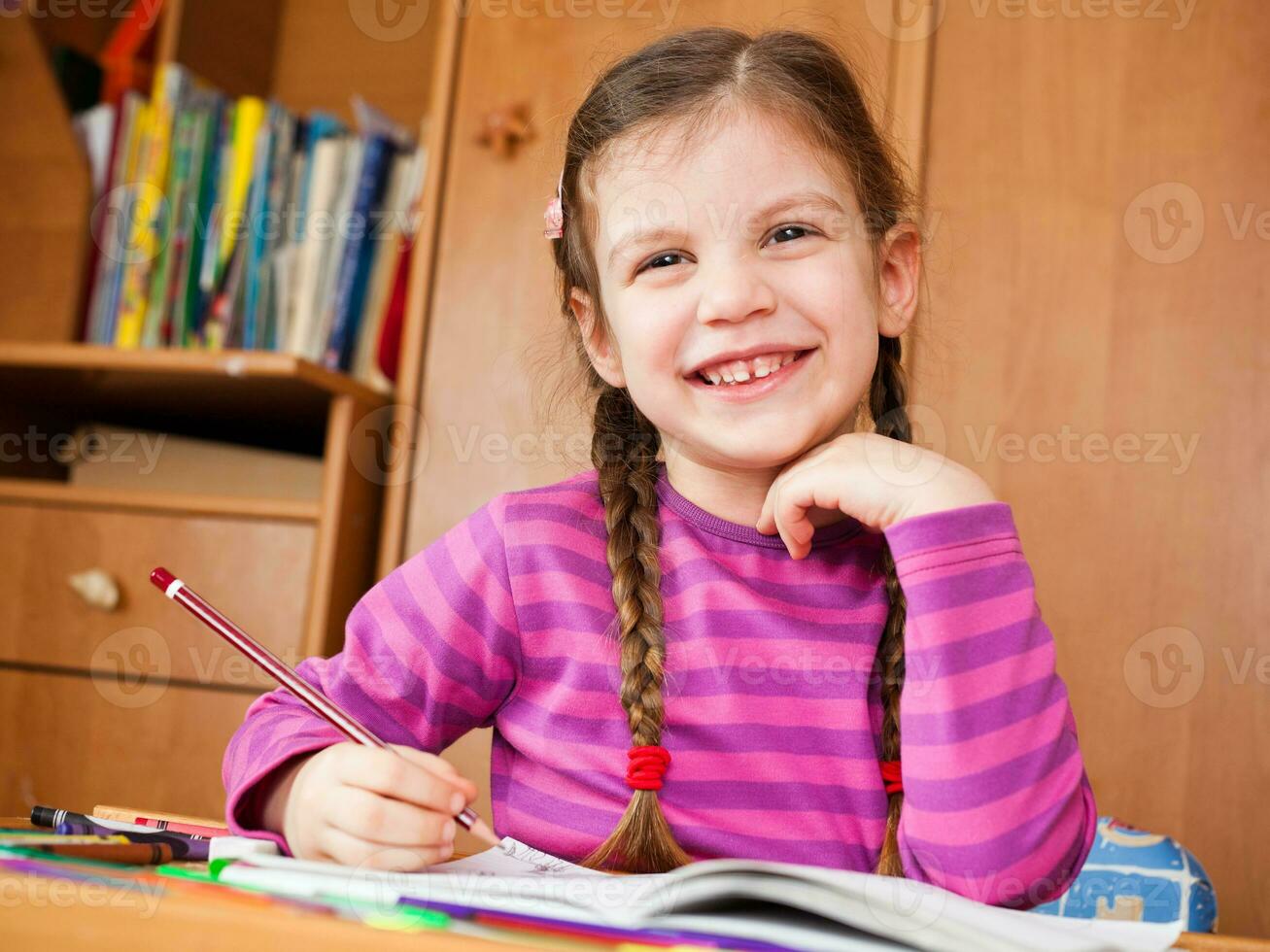 Little girl doing homework photo