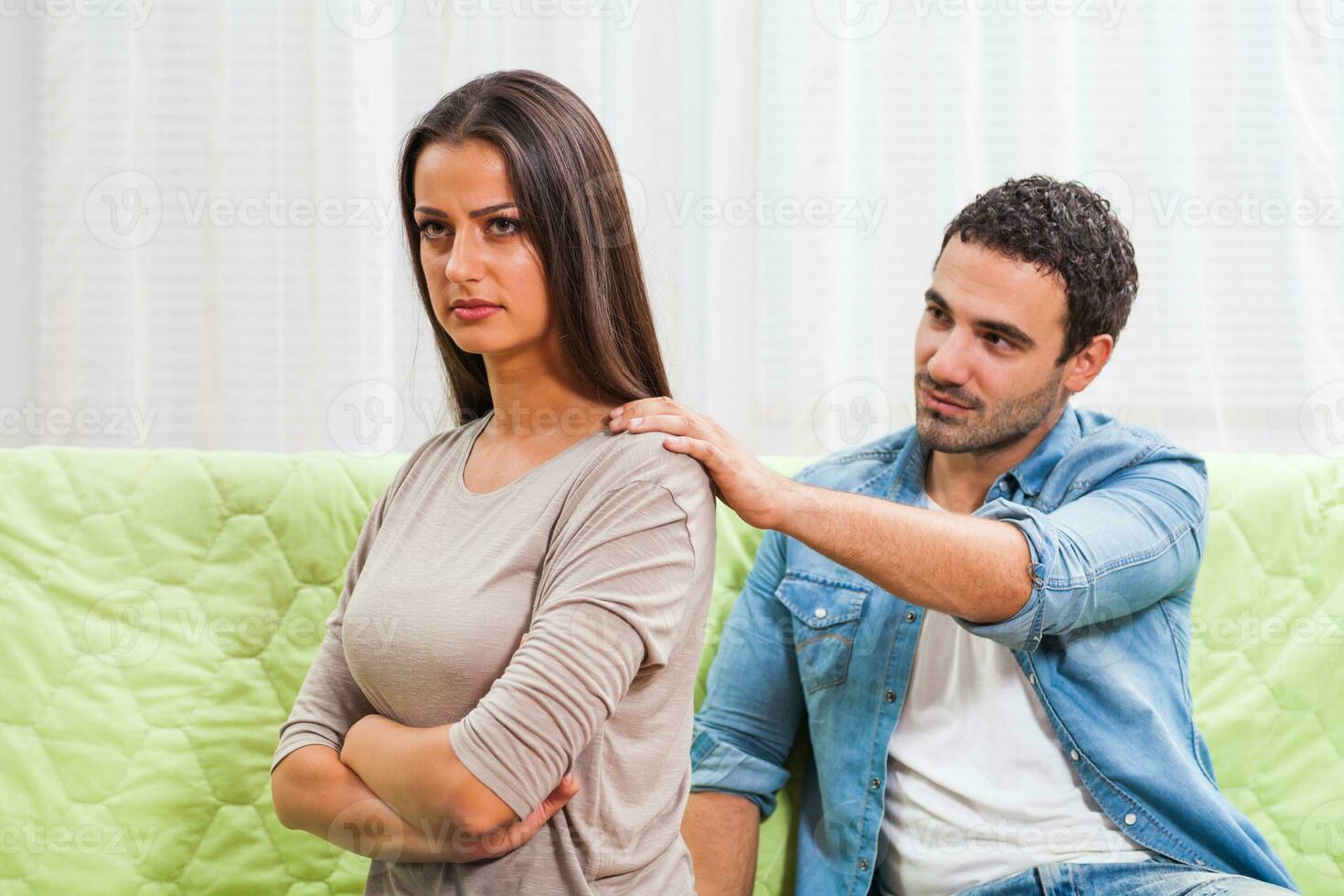 Portrait of a young couple arguing photo