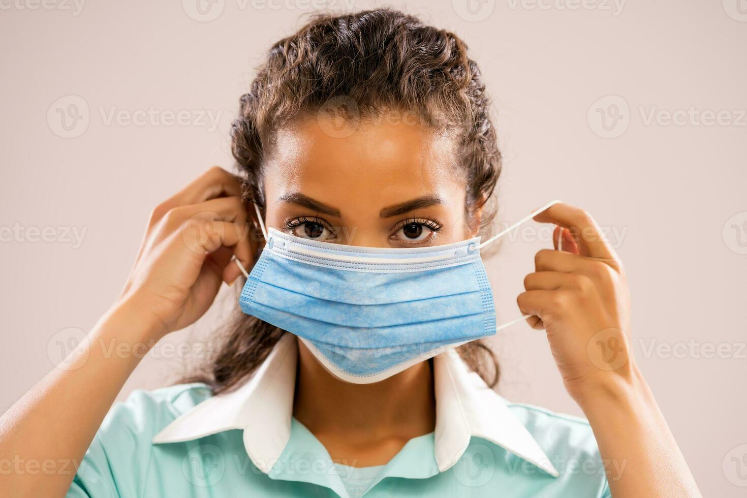 Portrait of a nurse wearing a face mask photo