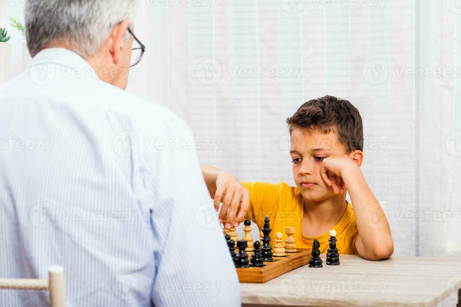 A grandfather spending time with his grandson photo