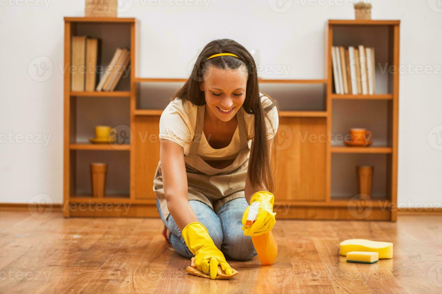 A woman cleaning the house photo