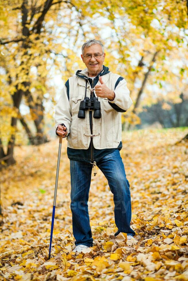 A senior man hiking photo