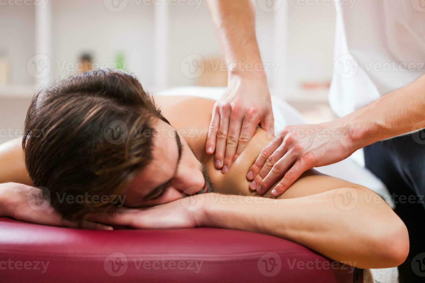 A man getting a back massage photo