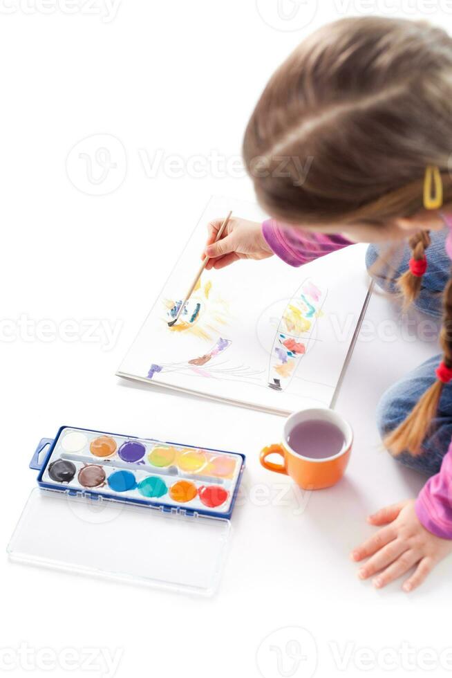 A little girl drawing photo