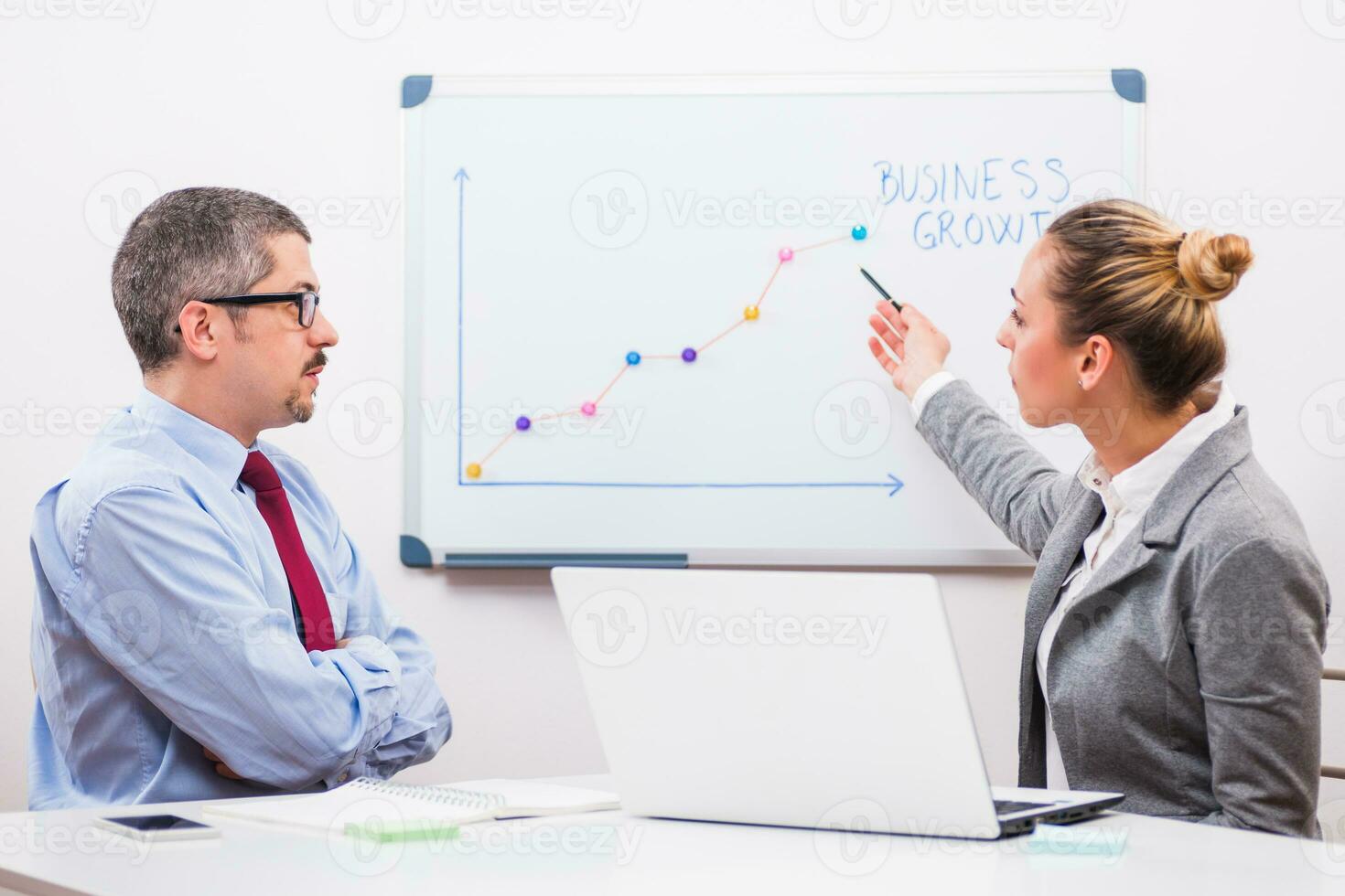 Business people discussing a business strategy photo