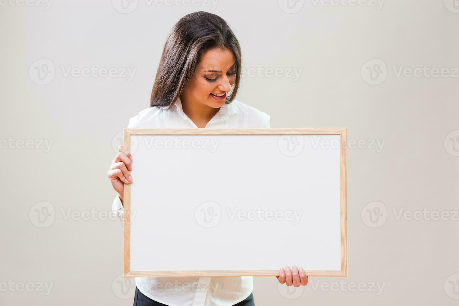 A woman with a blank board display photo