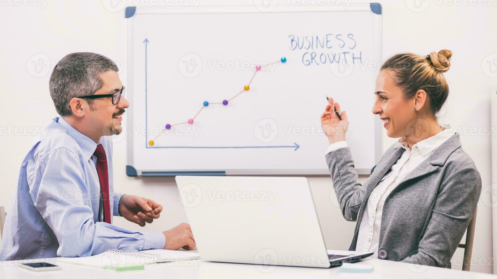 Business people discussing a business strategy photo