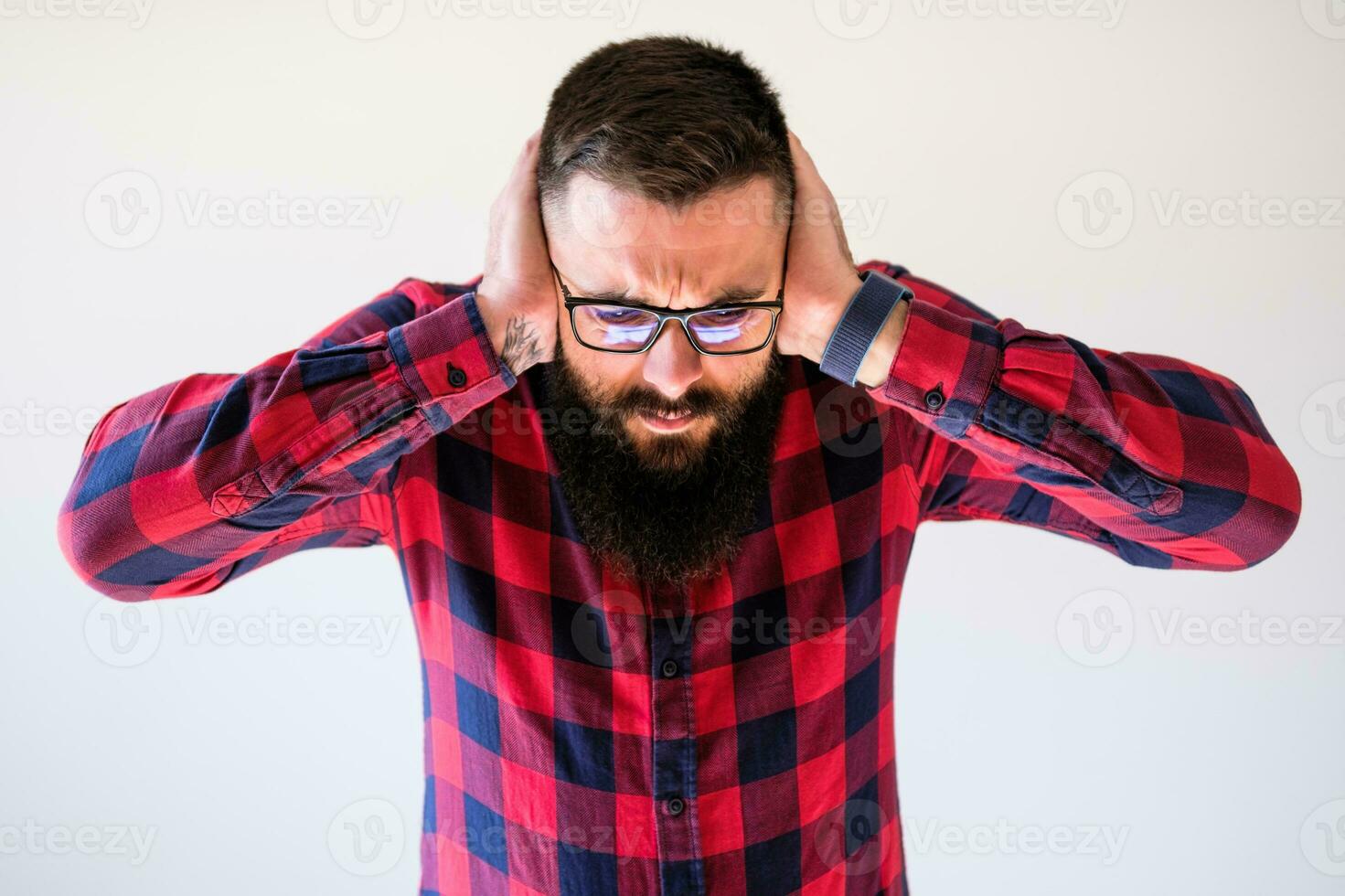 Portrait of a man in red and blue plaid shirt photo