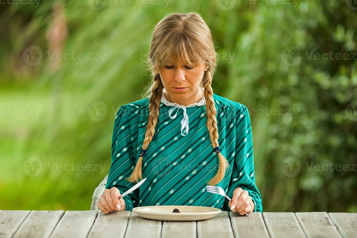 A woman at the table photo