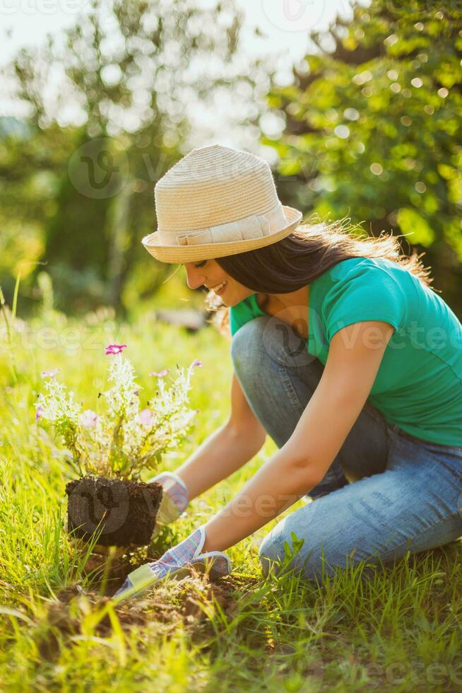 A young woman gardening photo