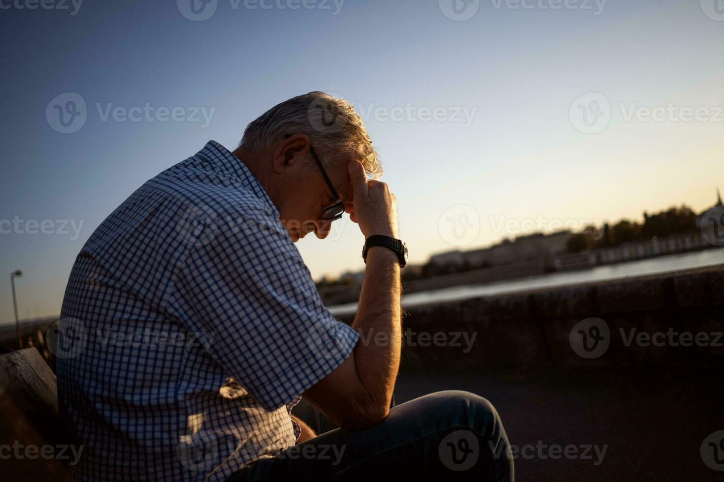 Upset senior man outside photo