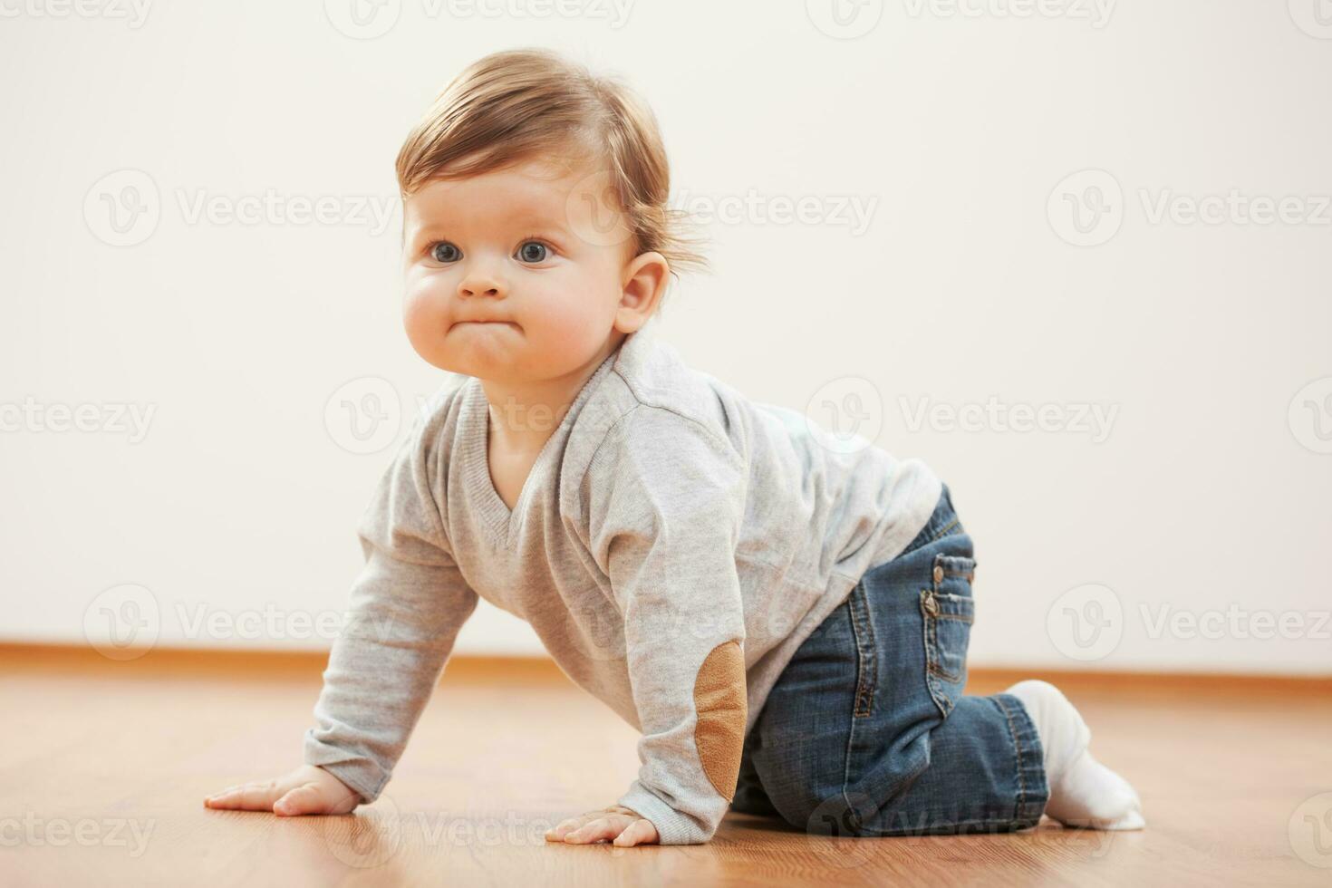 A small child on the floor photo
