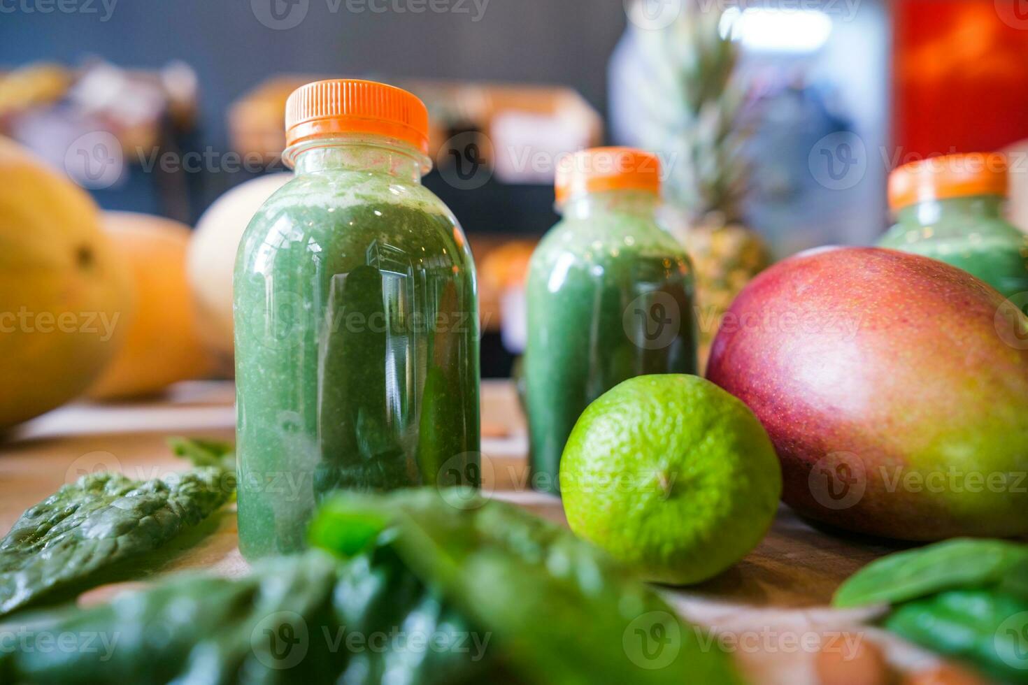 Healthy protein shake on table with fruits and vegetables ingredients around photo