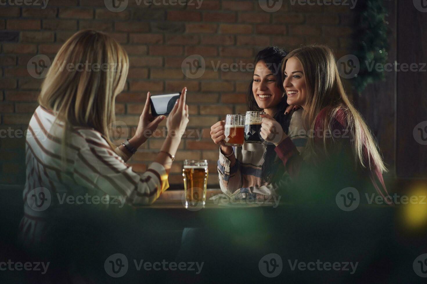 Friends having fun at the bar photo