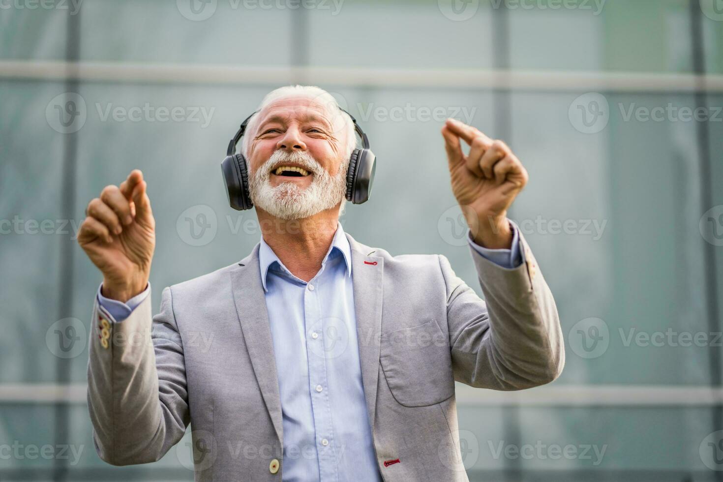 A senior man listening to music photo