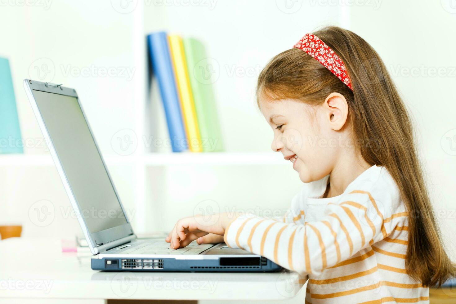 A girl using a laptop photo