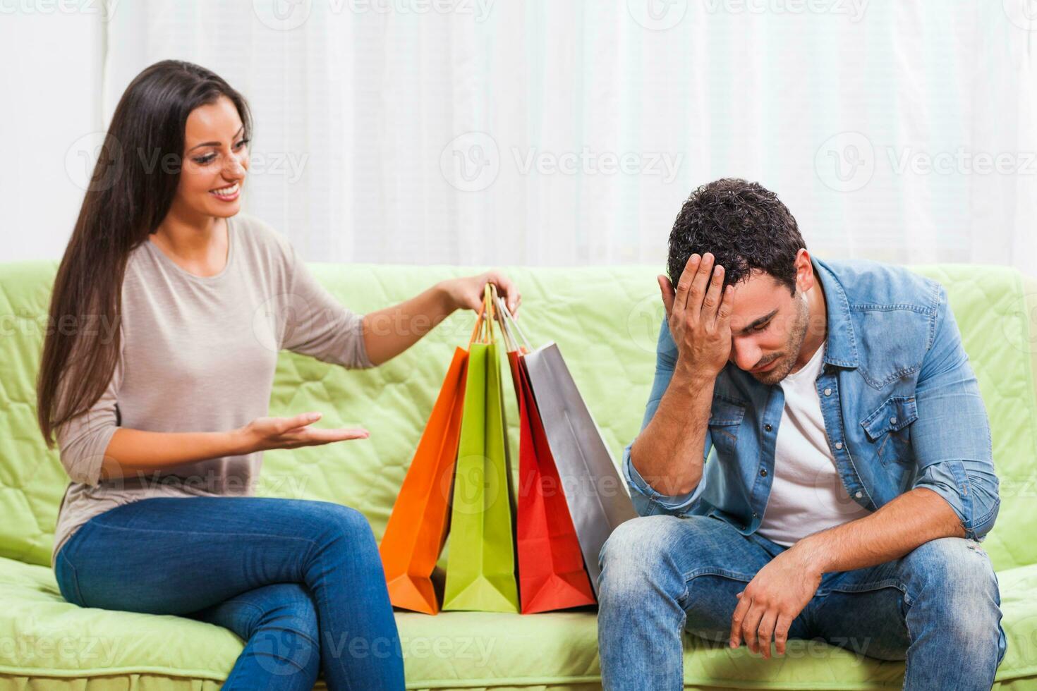 Portrait of a young couple arguing photo
