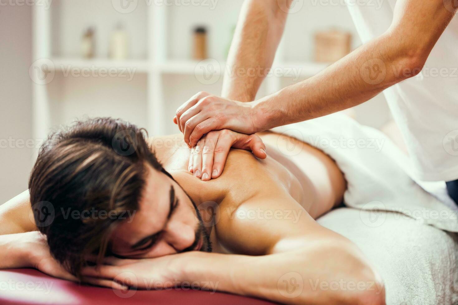 A man getting a back massage photo