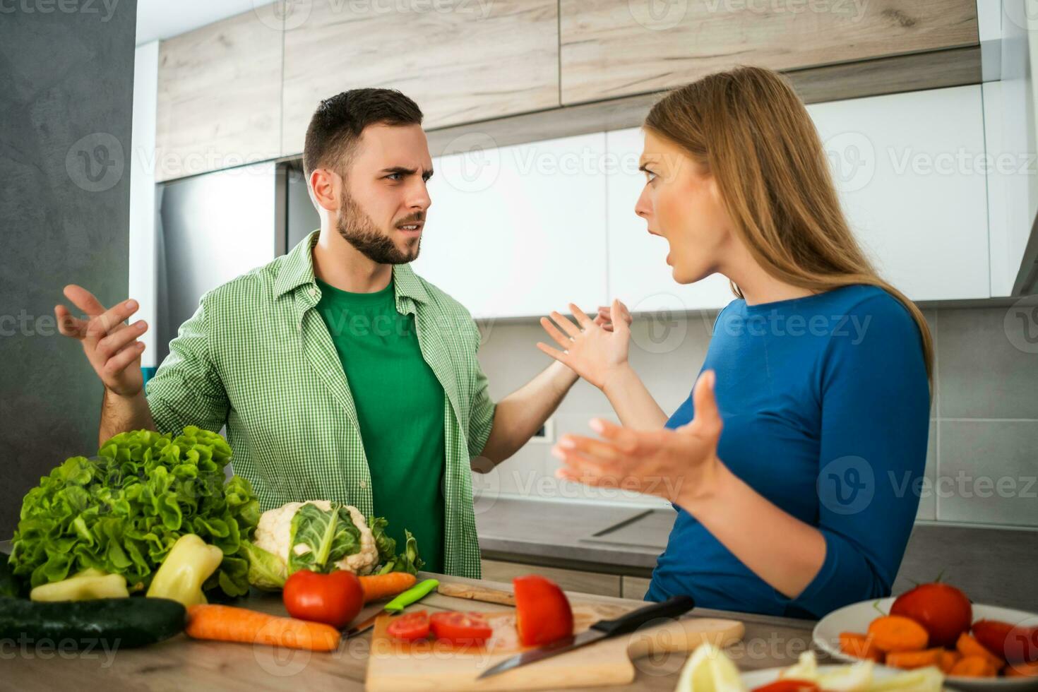 A young couple cooking together photo