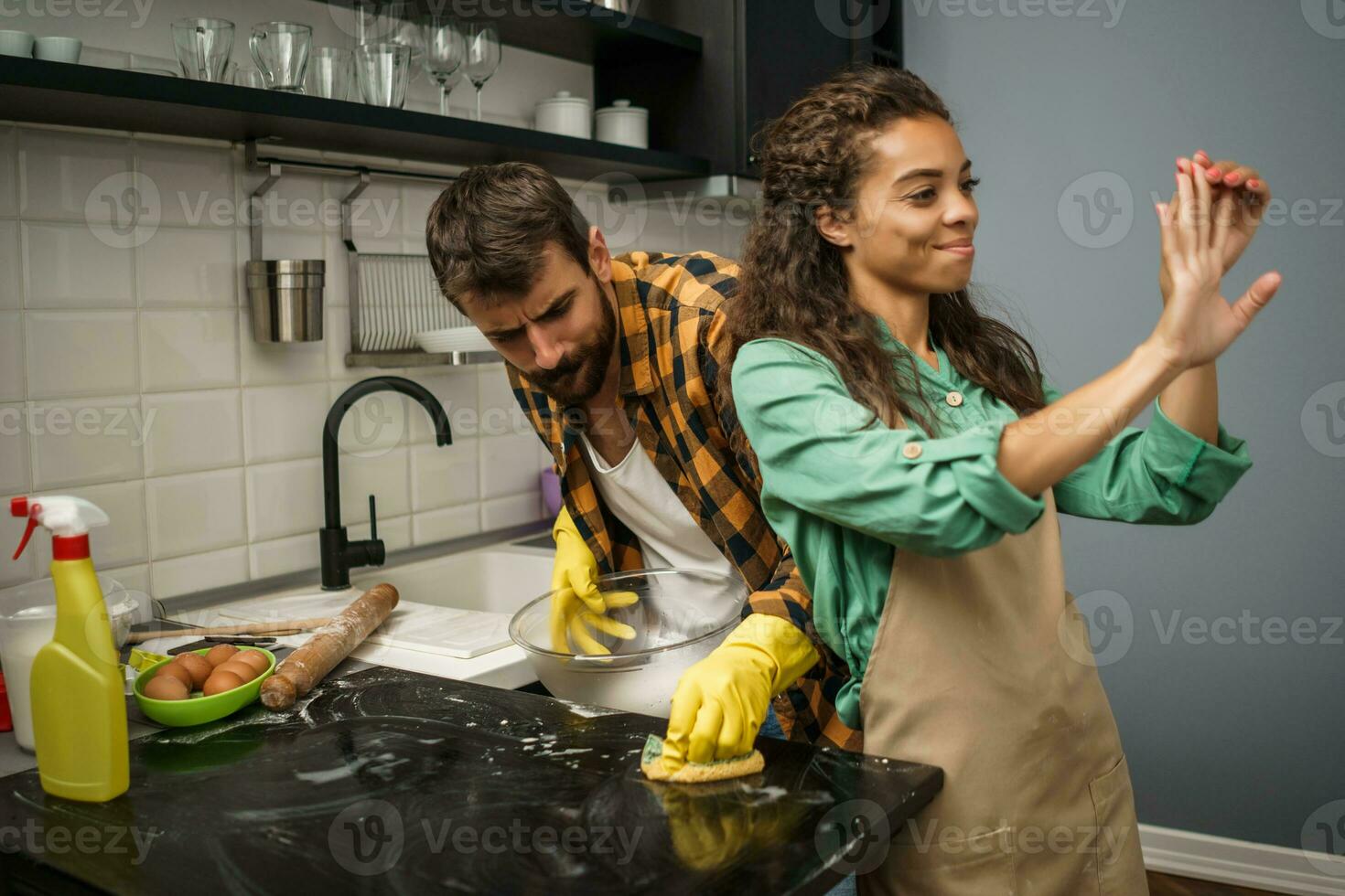 A couple cleaning the kitchen photo