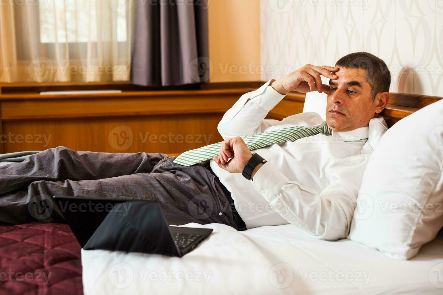 A businessman in a hotel room photo