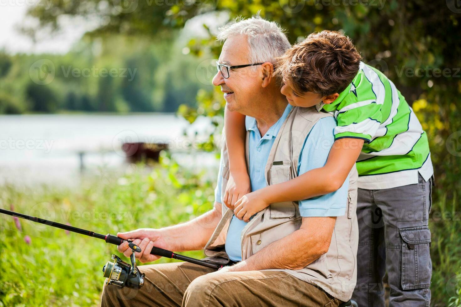 A grandfather and his nephew fishing photo