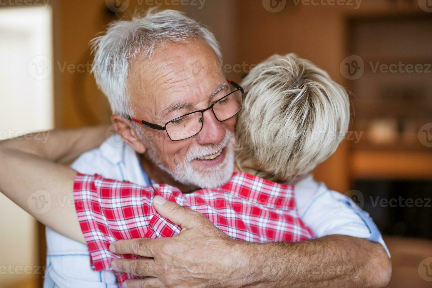 A senior couple hugging photo
