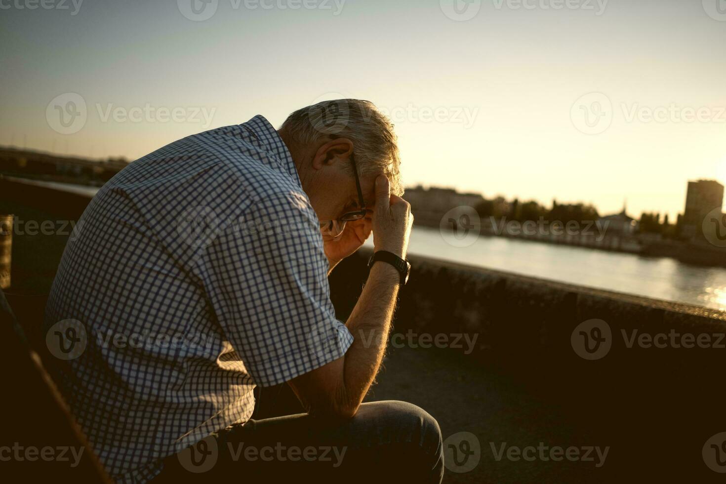 Upset senior man outside photo