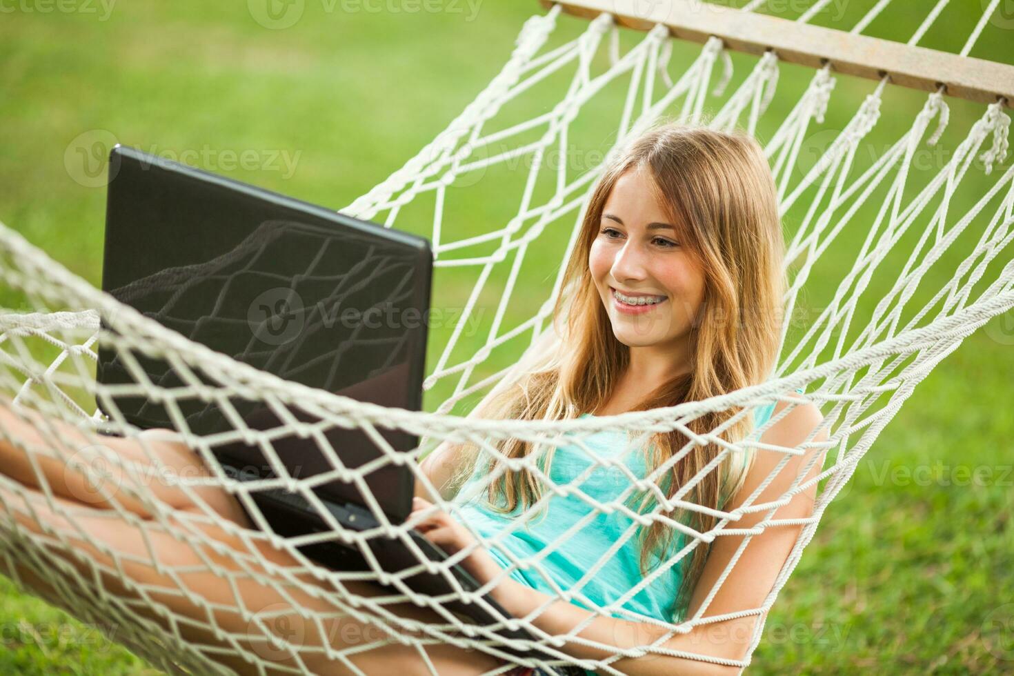 A young woman resting in a hammock photo