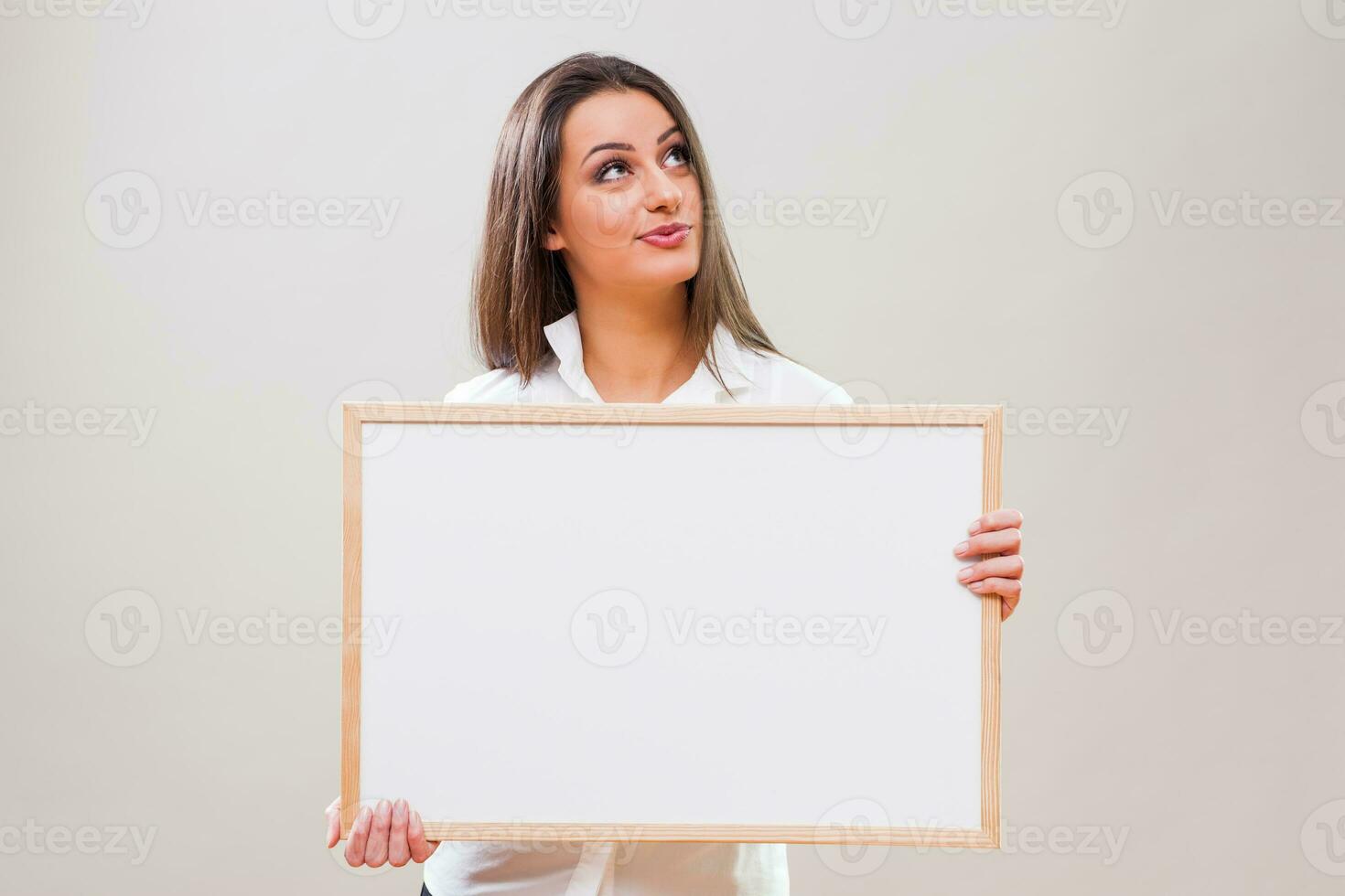 A woman with a blank board display photo