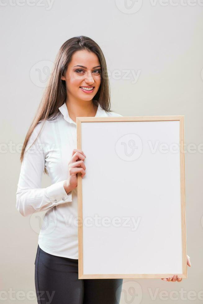 A woman with a blank board display photo