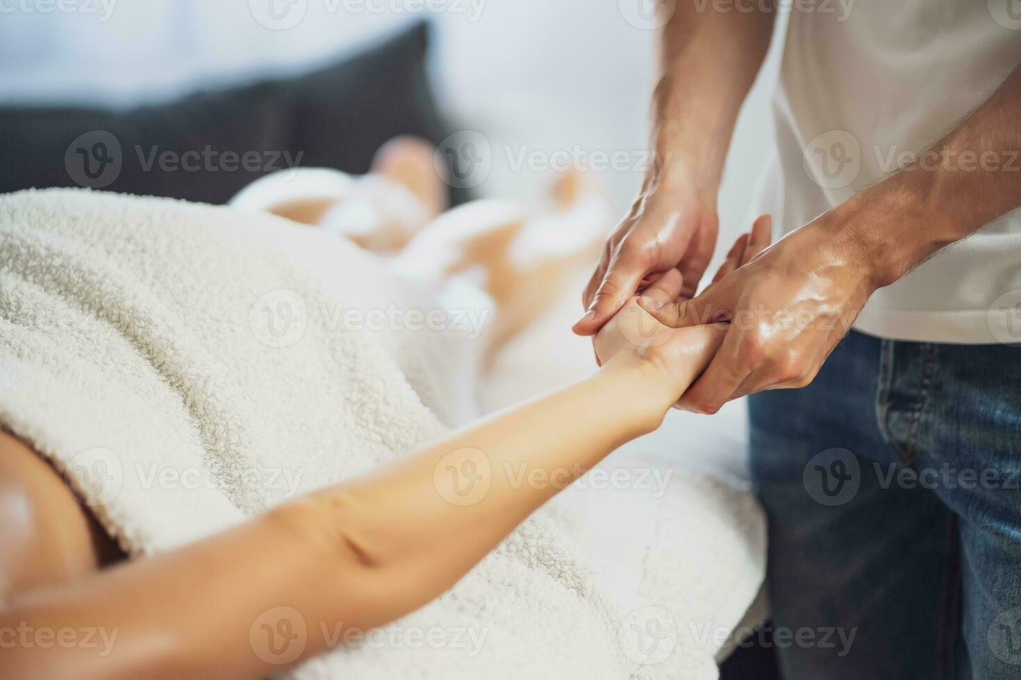 Woman enjoying a hand massage photo