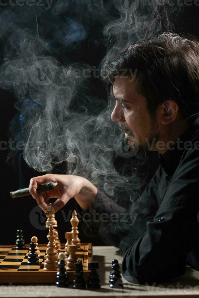 A man playing chess photo